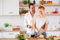 Image of young couple in love preparing breakfast in kitchen Royalty Free Stock Photo