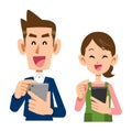 A young couple operating a smartphone with a smile