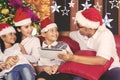 Young family with tablet at Christmas time Royalty Free Stock Photo