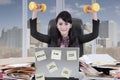 Young secretary holds dumbbells in the office Royalty Free Stock Photo