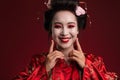 Image of young geisha woman in traditional japanese kimono smiling Royalty Free Stock Photo