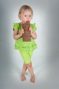 Young girl eating bar of chocolate Royalty Free Stock Photo