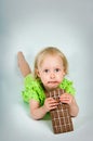 Young girl eating bar of chocolate Royalty Free Stock Photo