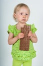 Young girl eating bar of chocolate Royalty Free Stock Photo