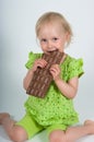 Young girl eating bar of chocolate Royalty Free Stock Photo