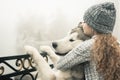 Image of young girl with her dog, alaskan malamute, outdoor Royalty Free Stock Photo