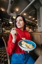 Young woman having fun and eating ice cream in coffee Royalty Free Stock Photo