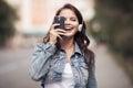 Image of young happy woman, listening music and having fun