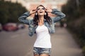 Image of young happy woman, listening music and having fun