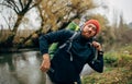 Image of young hiker male hiking in mountains with travel backpack. Traveler bearded man relaxing after mountaineering Royalty Free Stock Photo