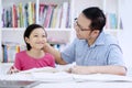 Young teacher patting head of his student Royalty Free Stock Photo