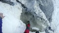 Image of young man mountaineer standing atop of rock at dangerous Couloir passage toward Mont Blanc