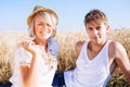 Image of young man and woman on wheat field Royalty Free Stock Photo