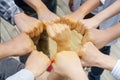 Image of people putting their fists together by having a fist in the middle as symbol of unity and achievement, top view. Royalty Free Stock Photo