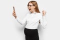 Image of a young pregnant business woman with glasses, angry and tired girl talking on the phone and shouting Royalty Free Stock Photo