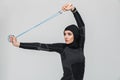 Woman fitness muslim make exercises with skipping rope isolated over white wall background Royalty Free Stock Photo