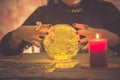 The image of a young woman is a fortune teller, a horoscope, a life in a magical crystal ball, and a gypsy card in the beliefs of Royalty Free Stock Photo