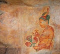 Image of a young woman on a rock surface. Sigiriya, Polonnaruwa, Sri Lanka