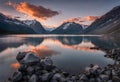 Beatiful sunset with mountains in the background and a lake, v6