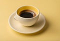 Blank coffee cup on the table. Isolated on yellow background, v13 Royalty Free Stock Photo