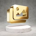 Images icon. Shiny golden Images symbol on white marble podium