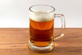 Light beer mug against the backdrop of the bar shelf Royalty Free Stock Photo