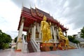 Images of a Walking Buddha and Seated Buddha at Wat Sitaram, a Thai monastery in Bangkok, Thailand