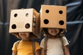 Imaginative play two little girls with cardboard boxes as headgear