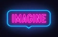 Imagine neon sign in the speech bubble on brick wall background. Royalty Free Stock Photo