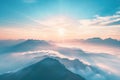 Imagine the top of the Alps mountains covered in clouds during sunrise in a foggy, golden hour Royalty Free Stock Photo