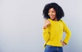 Imagine what you could do with that copy space. Studio shot of an attractive young woman pointing at copy space against