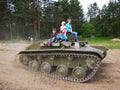 Children ride on the tank. The tank of the second world war rolls children and adults