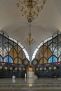 The Imam is the leader of the prayer, Religious muslim man praying for God on the floor in the Central Mosque and Islamic Center