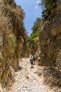 IMBROS GORGE, CRETE - 23 JULY 2021: Hikers exploring the narrow canyons and terrain of the Imbros Gorge in central Crete, Greece Royalty Free Stock Photo