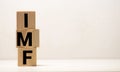 IMF Spelled with Wood Tiles Isolated on a White Background