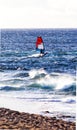 Solitary windsurfer rides the waves on Maui Royalty Free Stock Photo