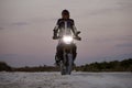 The biker rides enduro on a clay road