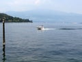 Lake maggiore view with boat and mountains, holiday trip, summer holiday Royalty Free Stock Photo