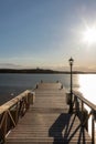 A swimming jetty during a golden sunset over the Turku Archipelago near the village of Naantali Royalty Free Stock Photo