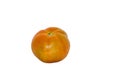 A ripe orange tomato with a slightly irregular shape rests on a plain white background. Royalty Free Stock Photo