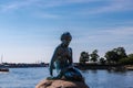 The statue of the little mermaid by the waterside at the Langelinie promenade in Copenhagen Royalty Free Stock Photo