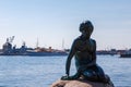 The statue of the little mermaid by the waterside at the Langelinie promenade in Copenhagen Royalty Free Stock Photo