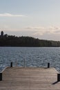 A swimming jetty during a golden sunset over the Turku Archipelago near the village of Naantali Royalty Free Stock Photo