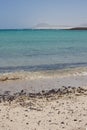 Stones on a beach breaking wave Lobos Island Corralejo, Fuerteventura.