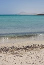 Stones on a beach breaking wave Lobos Island Corralejo, Fuerteventura.