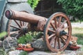 Imitation of an antique wooden cannon, garden decorations