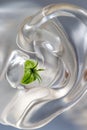 Imitation hearing aid -Conceptual photo-Close-up on white