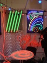 Decorative curtain made of LED threads and a neon cord