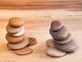 Figures lined with sea stones on a wooden board Royalty Free Stock Photo