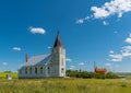 Immanuel Lutheran Church with grain elevator in Admiral, Saskatchewan, Canada